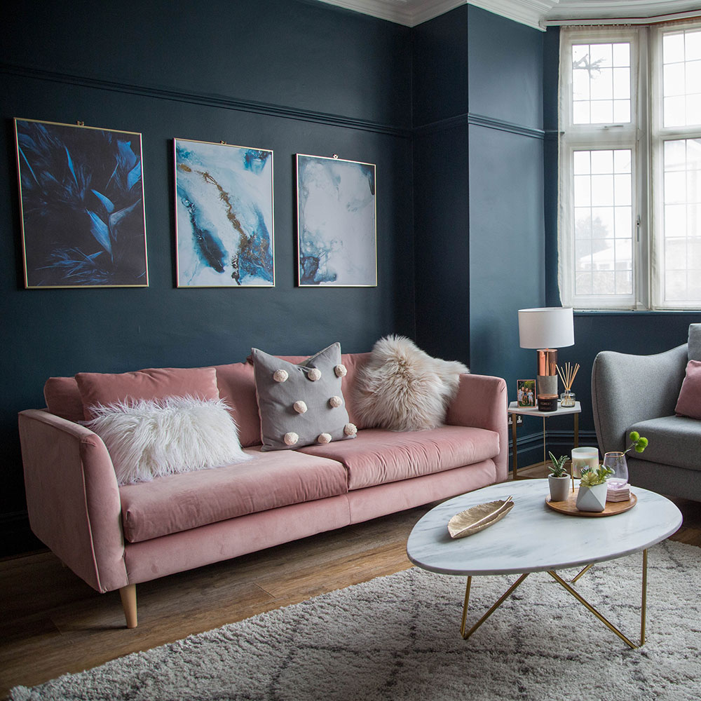 living-room-makeover-with-dark-blue-walls-pink-sofa-and-gold-accessories-2.jpg