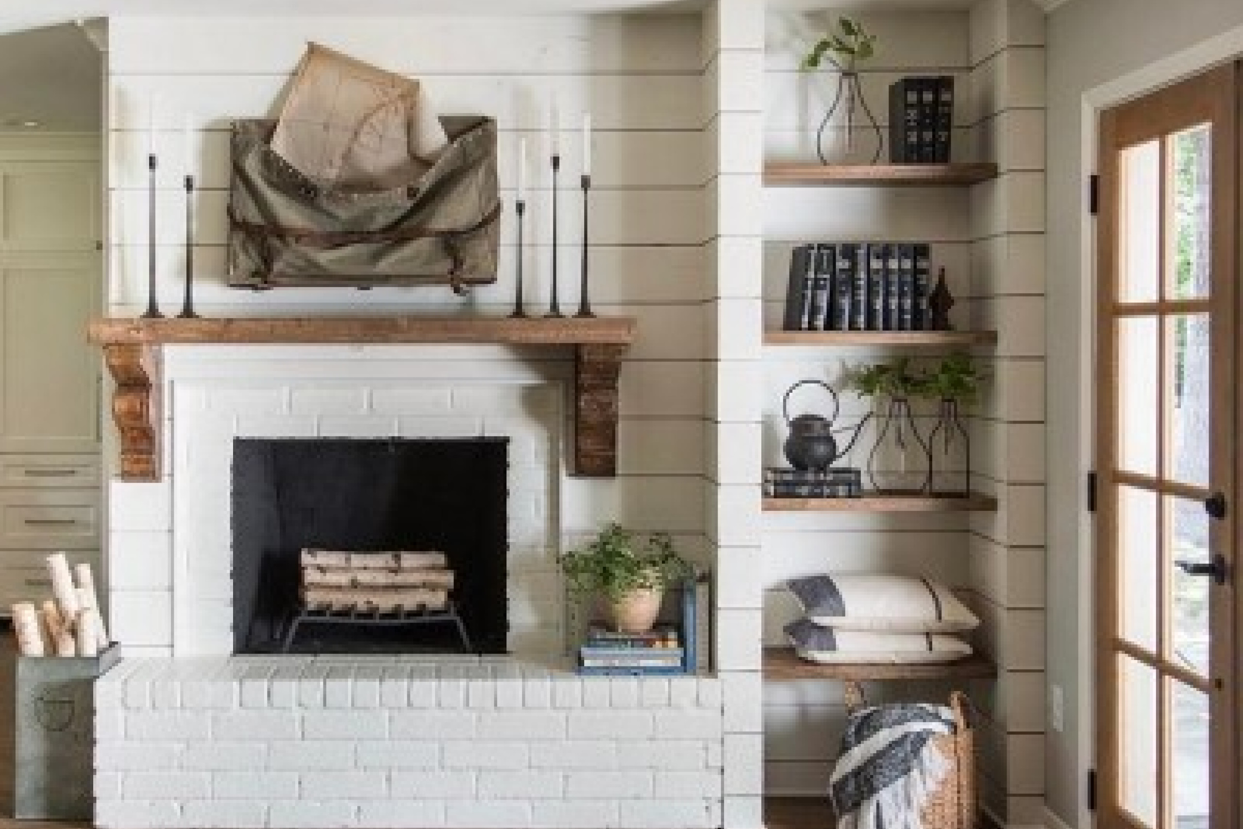 farmhouse-fireplace.-farmhouse-fireplace.-fixer-upper-farmhouse-fireplace.-hgtv-fixer-upper-farmhouse-fireplace-with-shiplap-reclaimed-wood-mantel-painted-brick-and-open-rustic-shelves.jpg